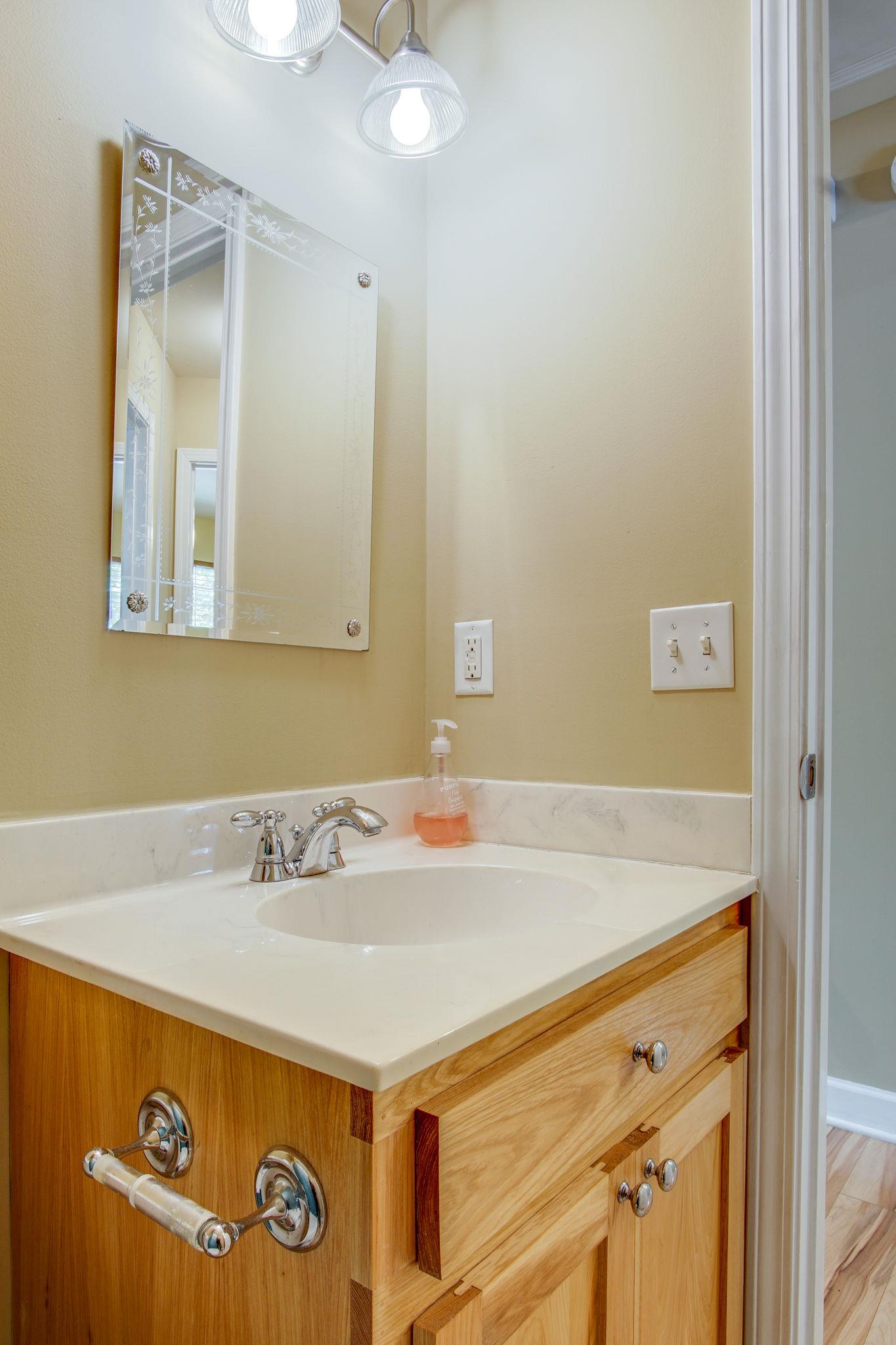 1674 Eno Road Dickson, TN 37055 - Photo 23 of 28 a bathroom with a sink and a mirror