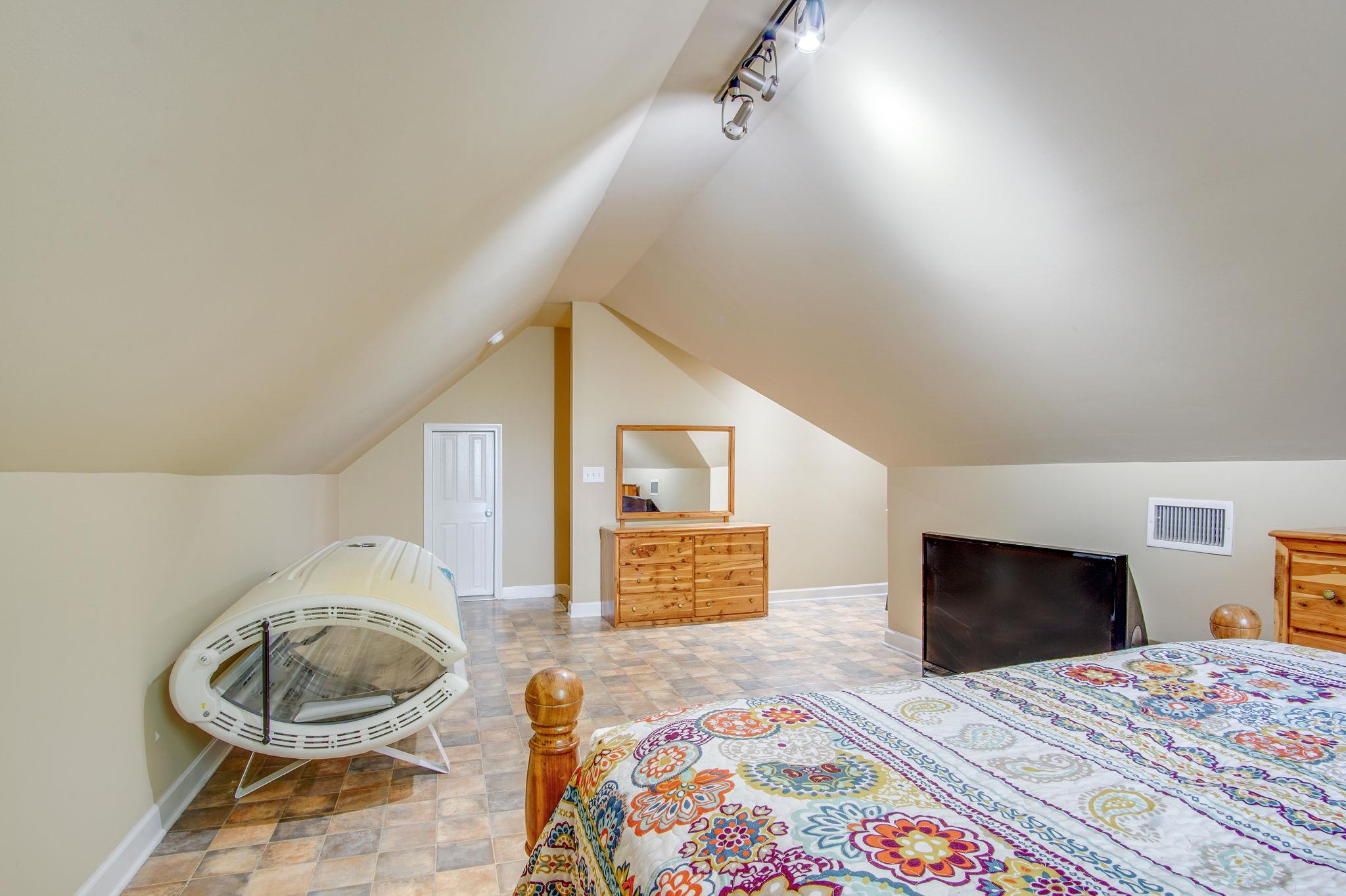 1674 Eno Road Dickson, TN 37055 - Photo 25 of 28 a bedroom with a bed and a flat screen tv