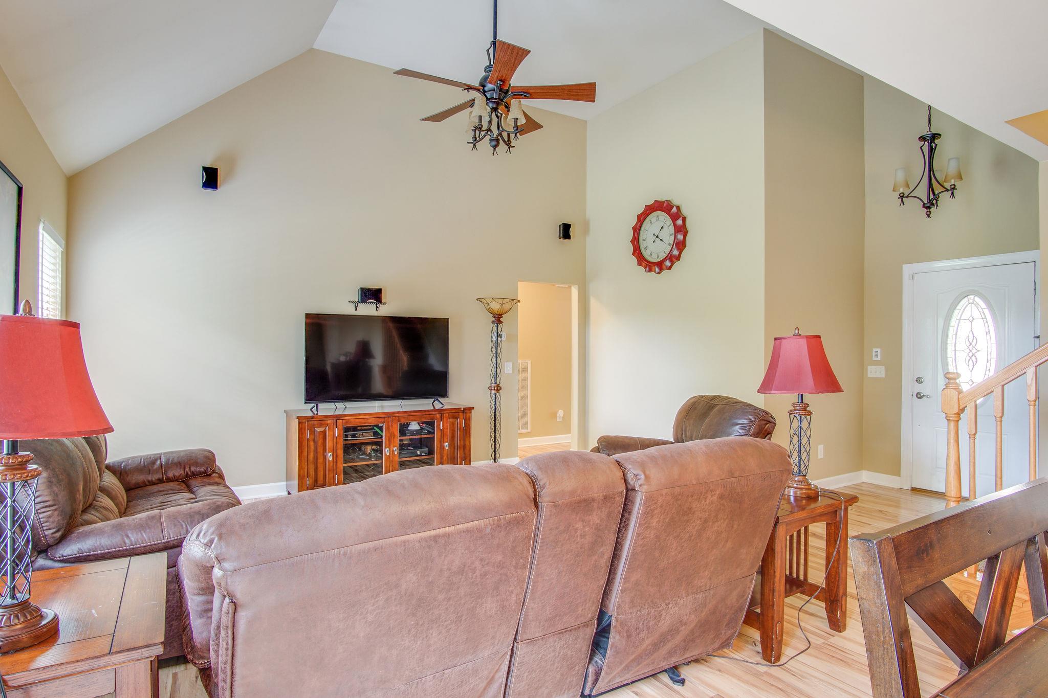 1674 Eno Road Dickson, TN 37055 - Photo 5 of 28 a bedroom with a bed and a flat screen tv