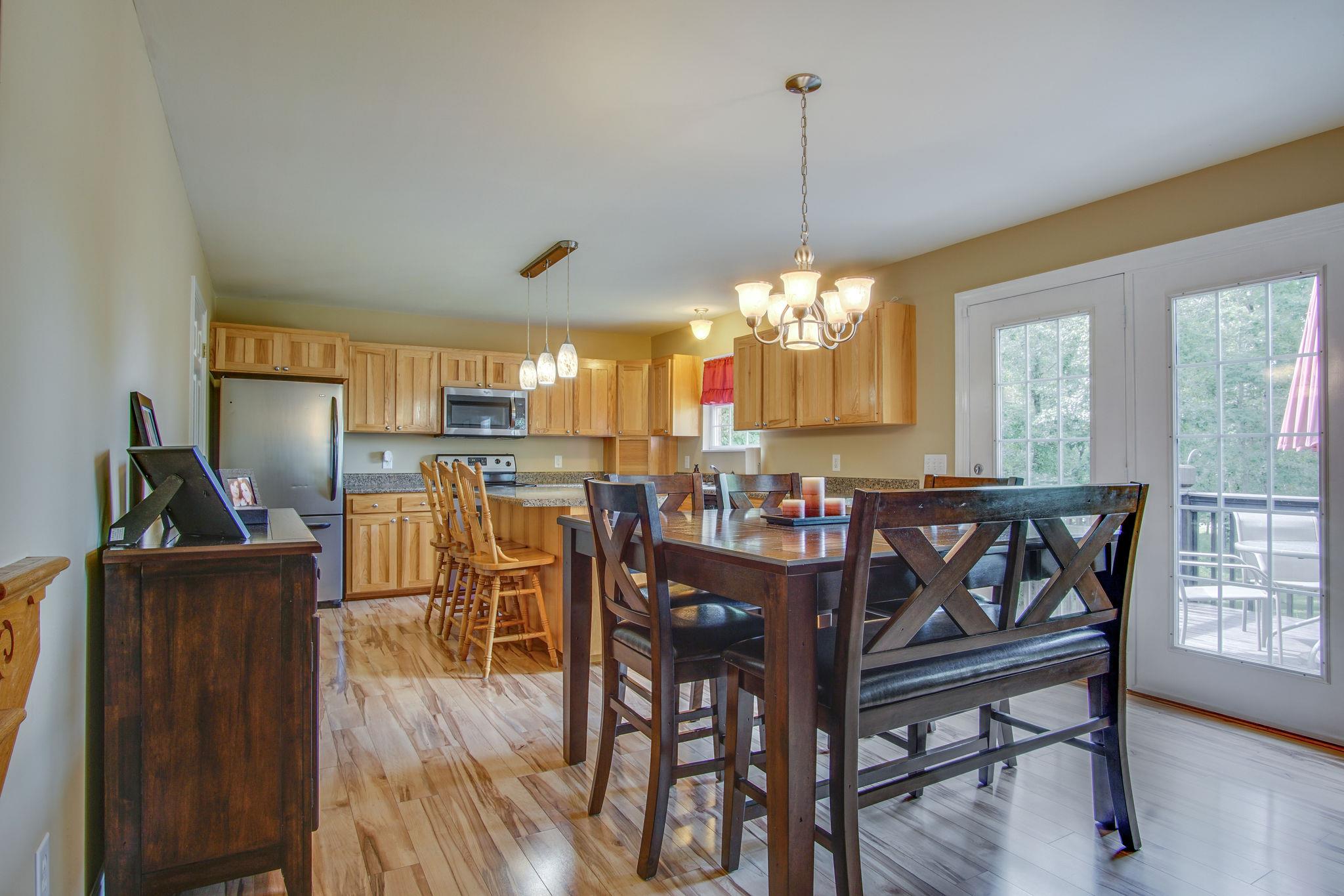 1674 Eno Road Dickson, TN 37055 - Photo 8 of 28 a view of a dining room with furniture window and wooden floor