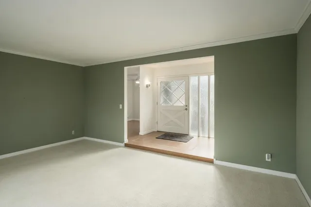 an empty room with a mirror