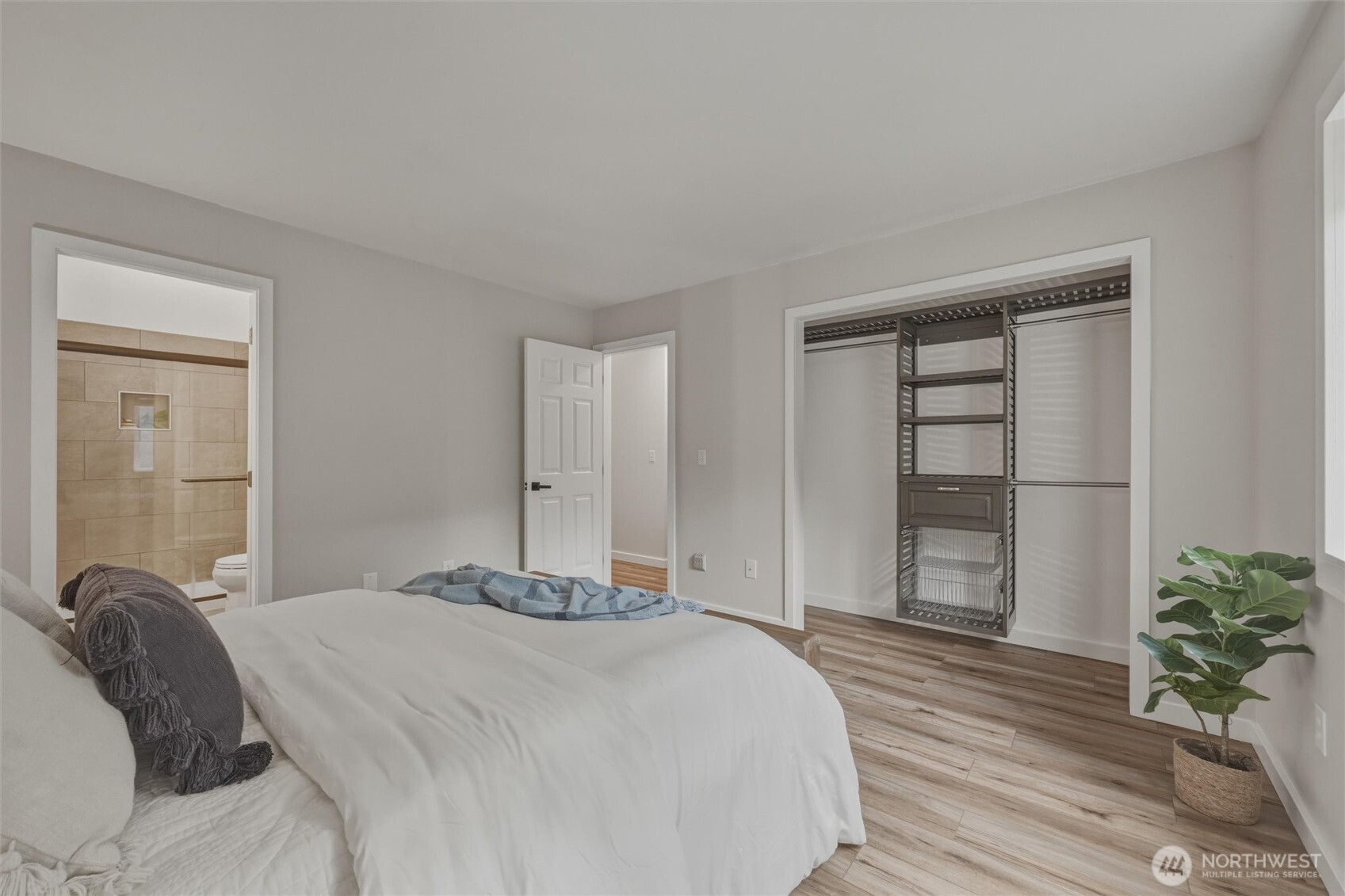 9 Sunnyside Lane Bellingham, WA 98229 - Photo 23 of 39 a bedroom with a bed and a potted plant