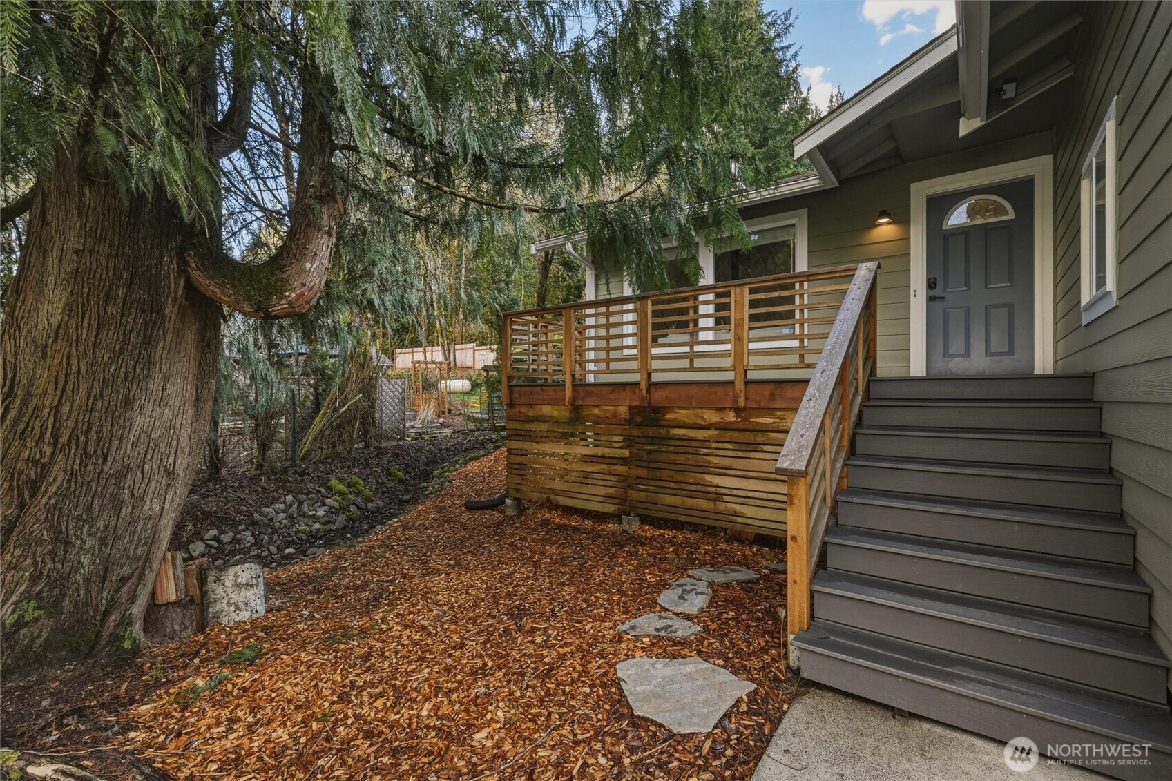 9 Sunnyside Lane Bellingham, WA 98229 - Photo 7 of 39 a view of a backyard with chairs and wooden fence