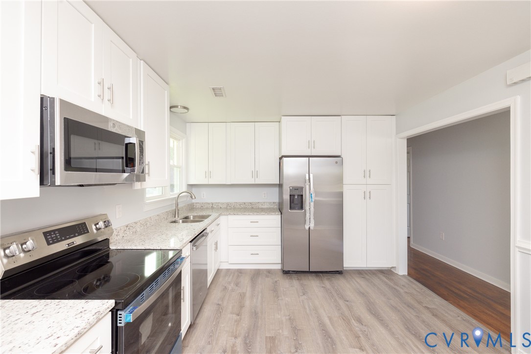 9825 Proctors Road Richmond, VA 23237 - Photo 6 of 20 Kitchen featuring stainless steel appliances, ligh