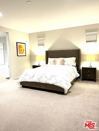 a bedroom with a bed and a television in it