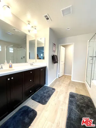 a bathroom with a toilet and a picture