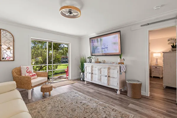 a living room with furniture and a window