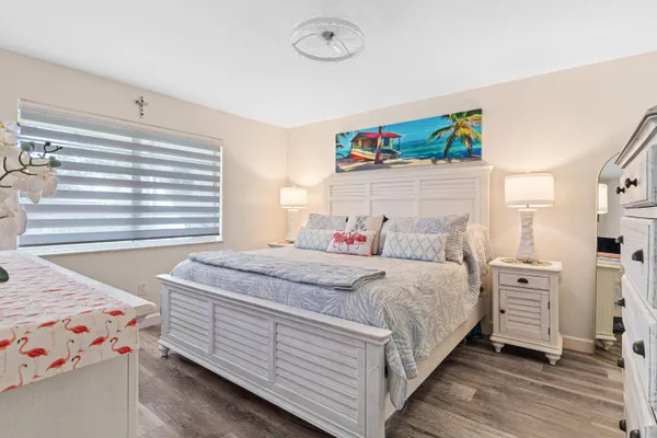 a bedroom with a bed and a dresser