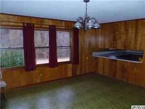 1122 Kendrick Road Gastonia, NC 28056 - Photo 3 of 7 a room with window and chandelier