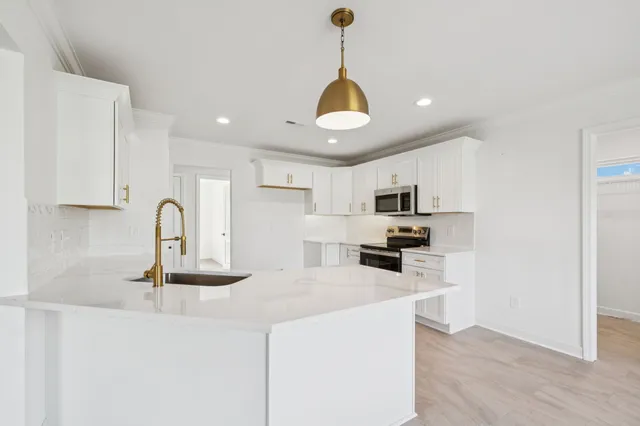 a bathroom with a tub sink and shower