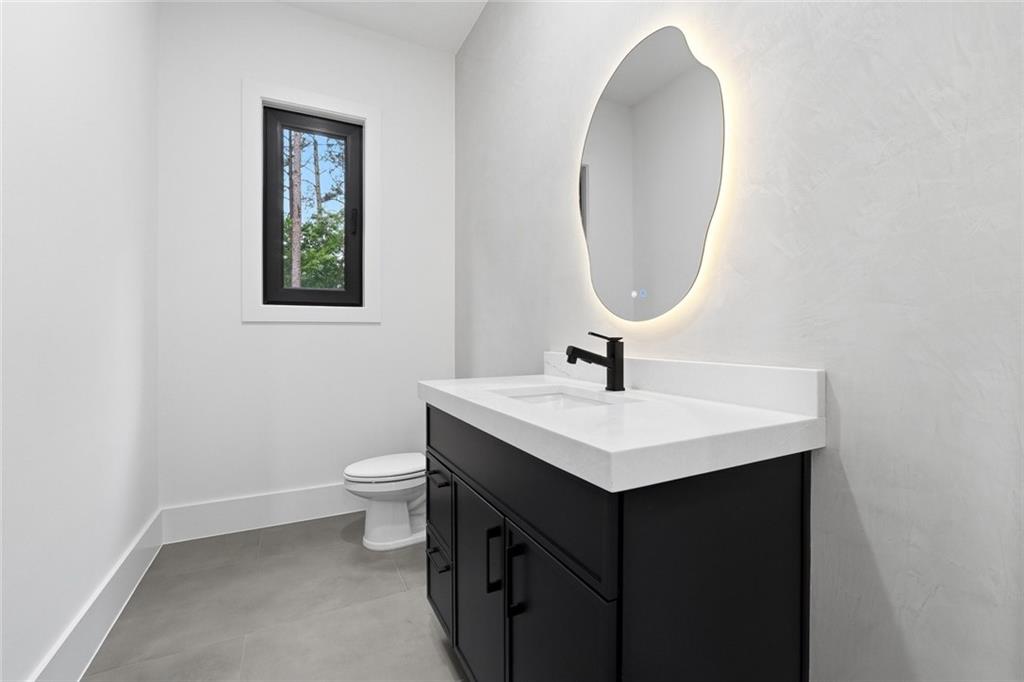 1563 Whitley Road Dacula, GA 30019 - Photo 34 of 44 a bathroom with a sink and a toilet