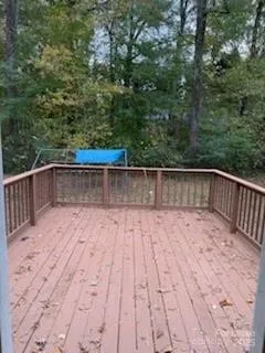 a white house that has a tree in front of it