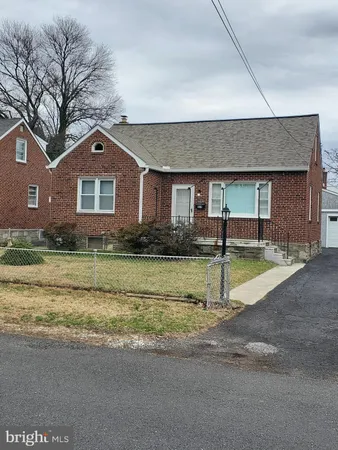 a view of pool with a yard