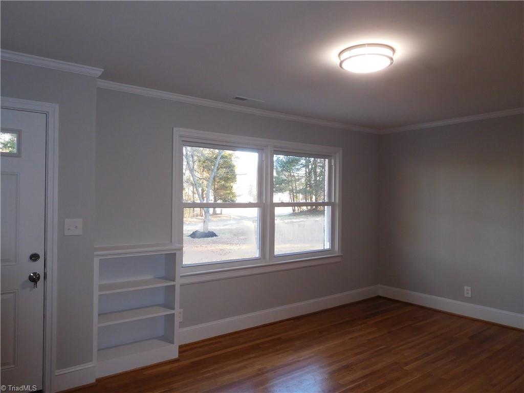 839 Central Road Clemmons, NC 27012 - Photo 3 of 35 Large Living room with Hardwood floors and built-in shelf. Beautiful room w/natural light.