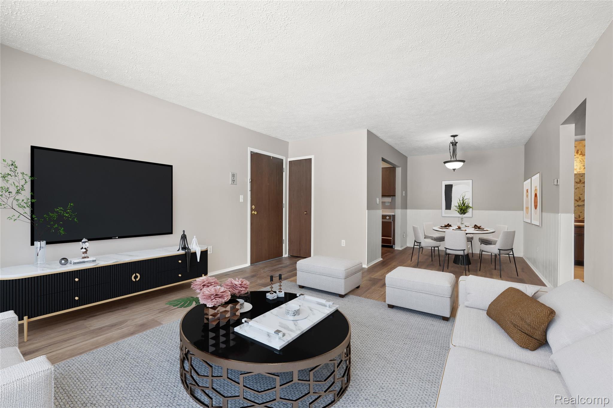 4909 Crooks Road, Unit D6 Royal Oak, MI 48073 - Photo 6 of 16 Living area featuring wood finished floors and a textured ceiling