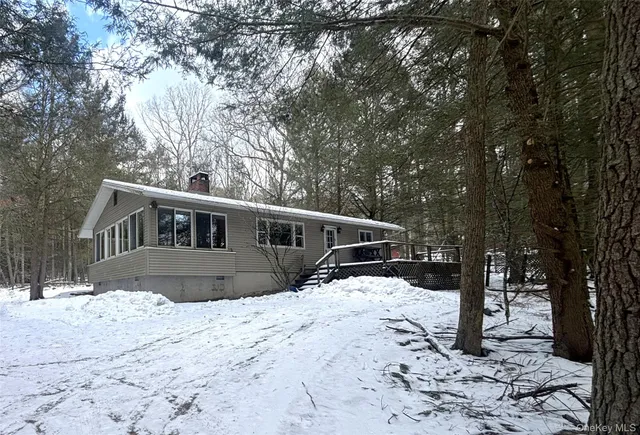 a wooden fence with trees in the background
