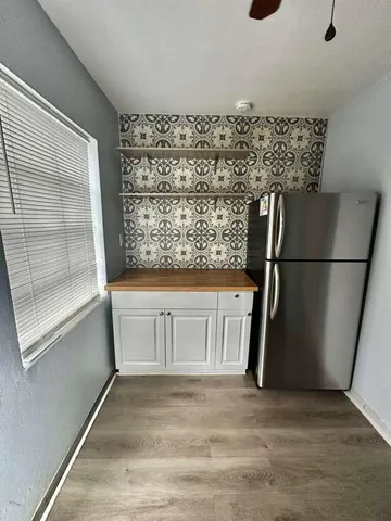 a view of a refrigerator in a kitchen