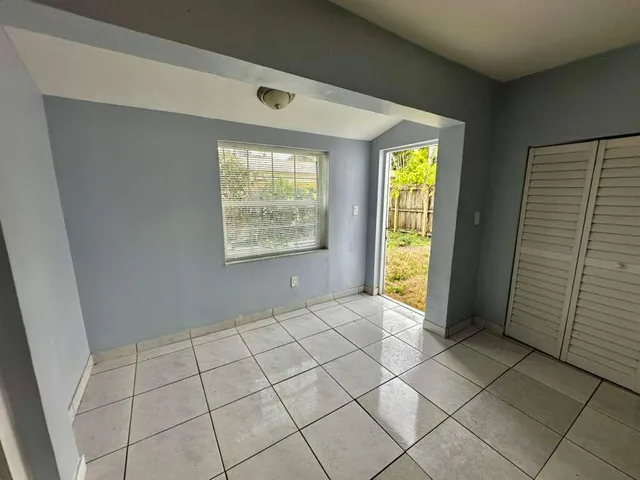 a view of an empty room and window