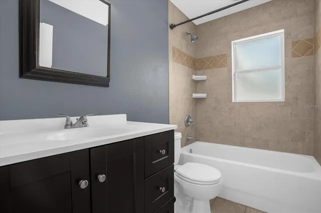 a bathroom with a sink a toilet and a bathtub