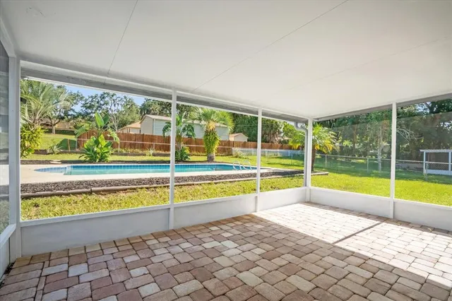 a view of a living room and a large window