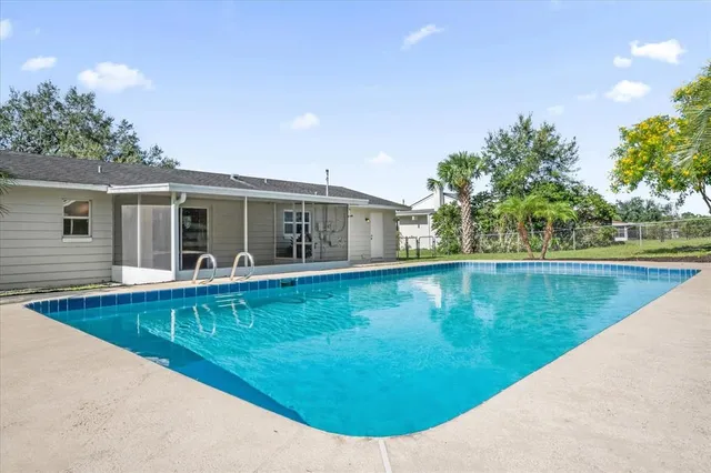 a view of a house with swimming pool