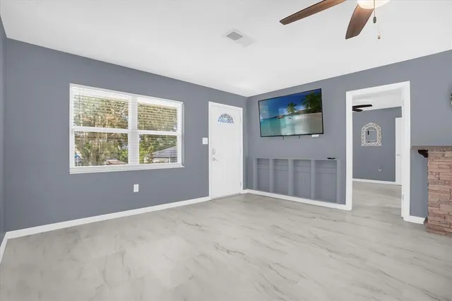 a view of an empty room with a window