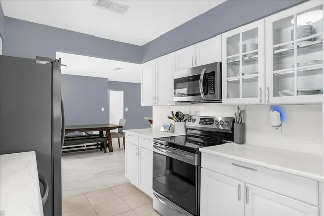 a kitchen with a stove and a microwave