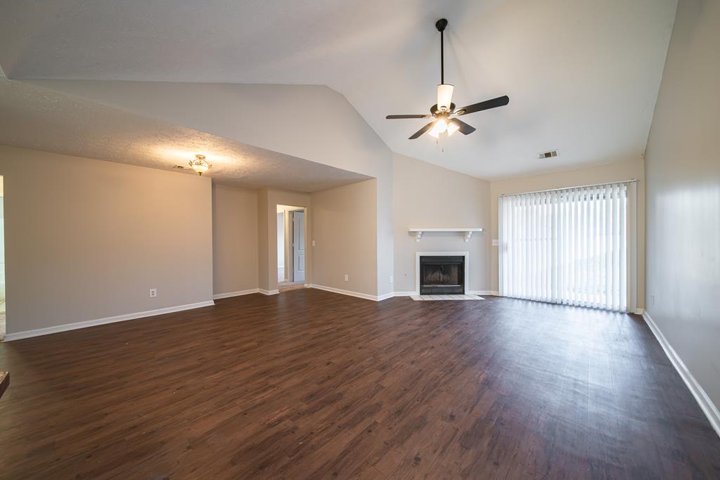 5825 Stafford Lane Columbus, GA 31907 - Photo 13 of 33 a view of empty room with wooden floor and fan
