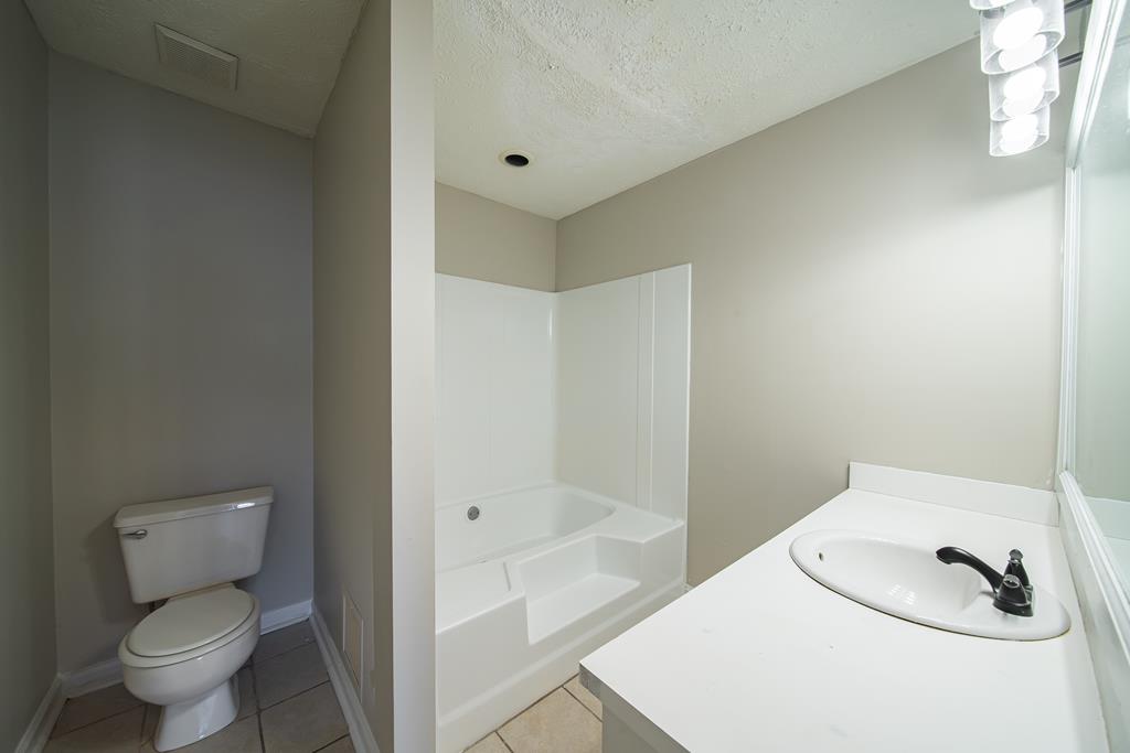 5825 Stafford Lane Columbus, GA 31907 - Photo 22 of 33 a bathroom with a sink and a toilet