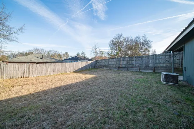 a view of a backyard of the house