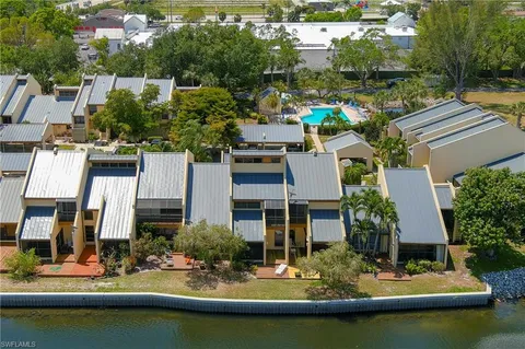 an aerial view of residential houses with outdoor space