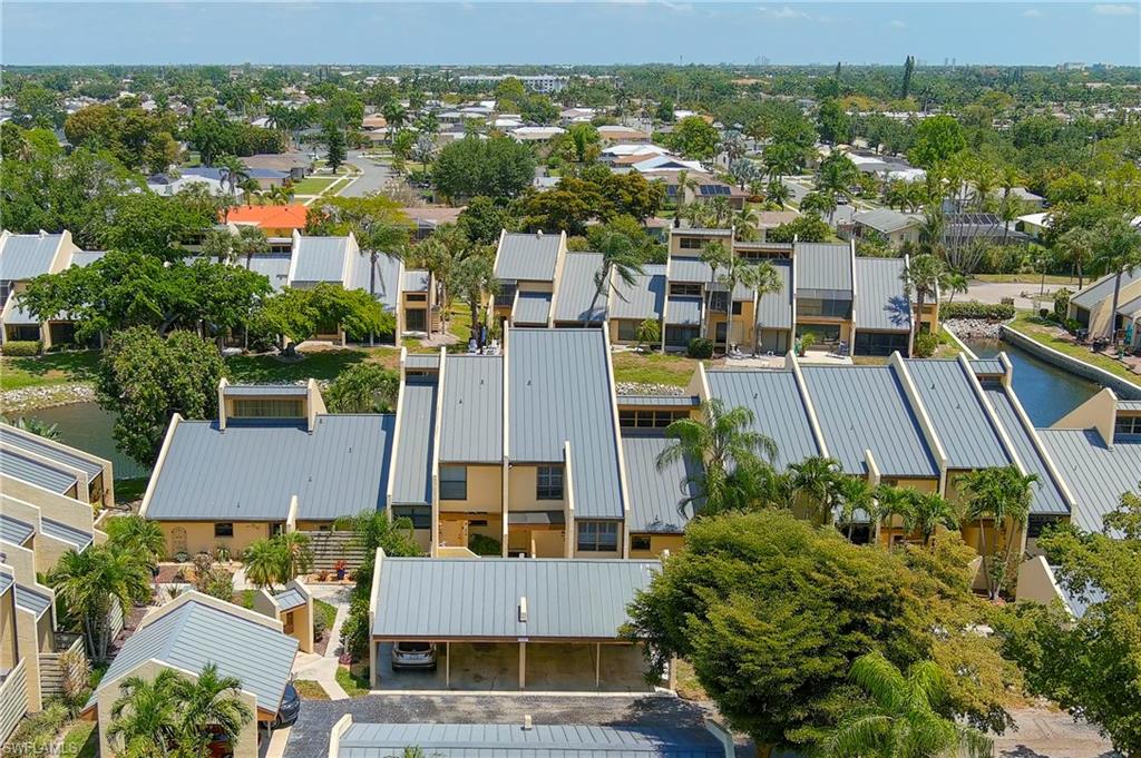 8765 Lateen Lane, Unit 203 Fort Myers, FL 33919 - Photo 23 of 28 an aerial view of residential houses with outdoor space