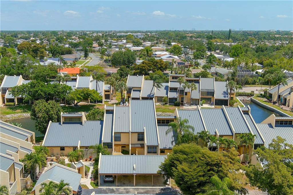 8765 Lateen Lane, Unit 203 Fort Myers, FL 33919 - Photo 24 of 28 an aerial view of residential houses with outdoor space