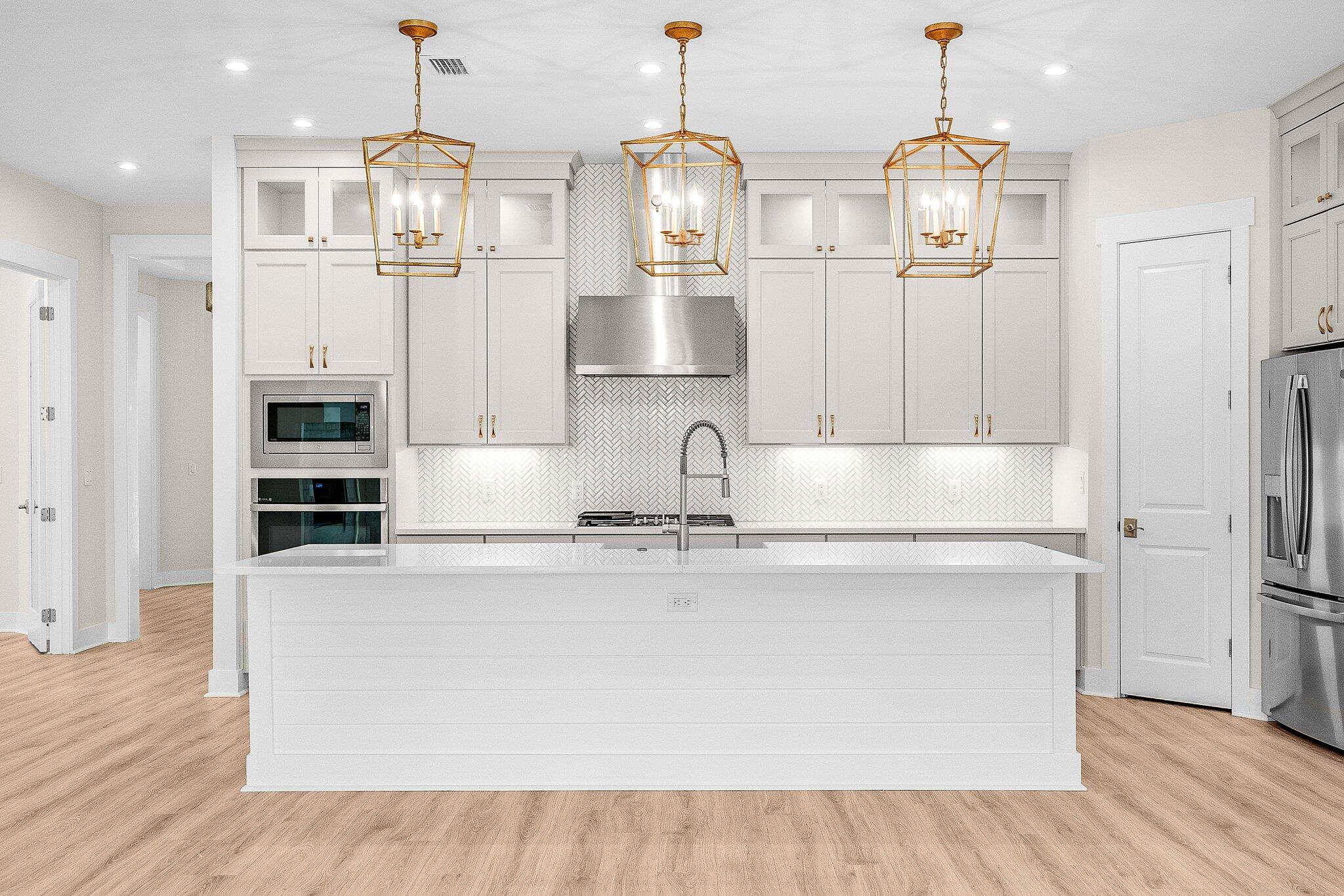 47 Ravine Rd Inlet Beach Inlet Beach, FL 32461 - Photo 21 of 85 a kitchen with stainless steel appliances granite countertop a refrigerator a stove and a wooden floors