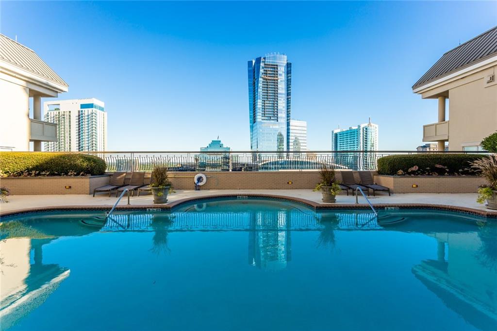 3334 Peachtree Road Northeast, Unit 910 Atlanta, GA 30326 - Photo 21 of 35 a view of a swimming pool with outdoor seating