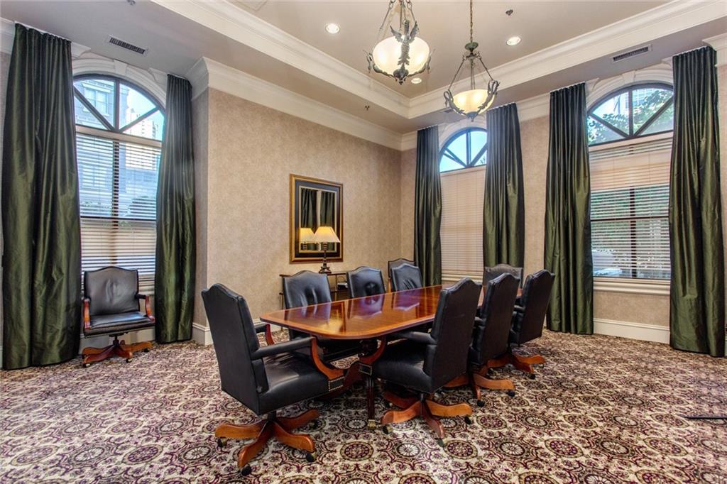 3334 Peachtree Road Northeast, Unit 910 Atlanta, GA 30326 - Photo 23 of 35 a living room with furniture and a chandelier