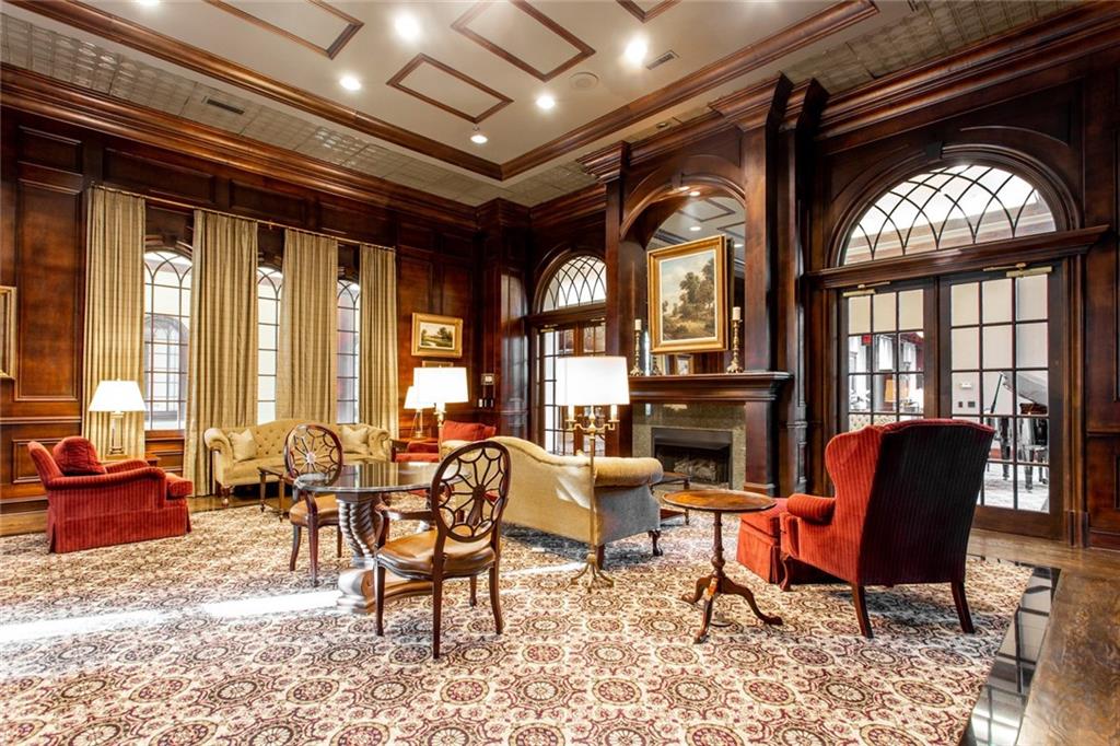 3334 Peachtree Road Northeast, Unit 910 Atlanta, GA 30326 - Photo 24 of 35 a living room with furniture and a large window