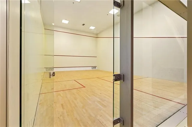 a living room with furniture fireplace and a large window