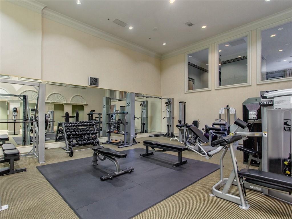 3334 Peachtree Road Northeast, Unit 910 Atlanta, GA 30326 - Photo 29 of 35 a living room with lots of gym equipment