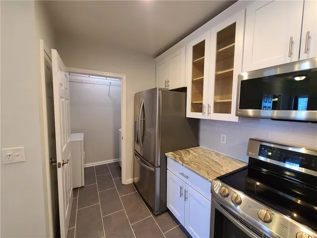 a bathroom with a shower and toilet