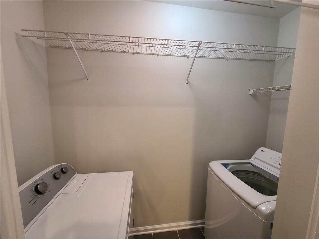 3334 Peachtree Road Northeast, Unit 910 Atlanta, GA 30326 - Photo 8 of 35 a bathroom with a shower and toilet