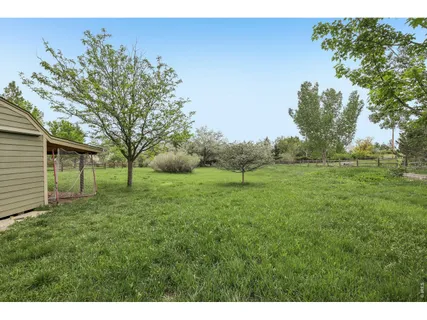 a backyard of a house with lots of green space