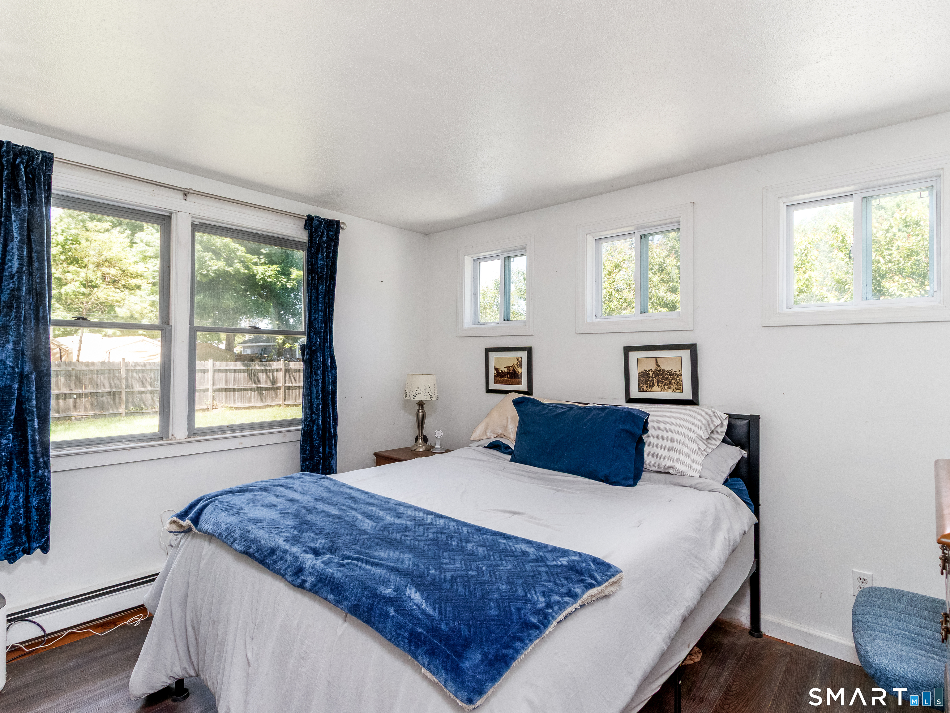 15 Bluff Avenue Clinton, CT 06413 - Photo 17 of 38 a bedroom with a large bed and a window