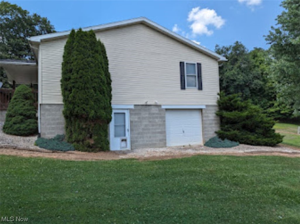 965 Access Road Williamstown, WV 26187 - Photo 3 of 11 Walk out man door and garage door with full basement