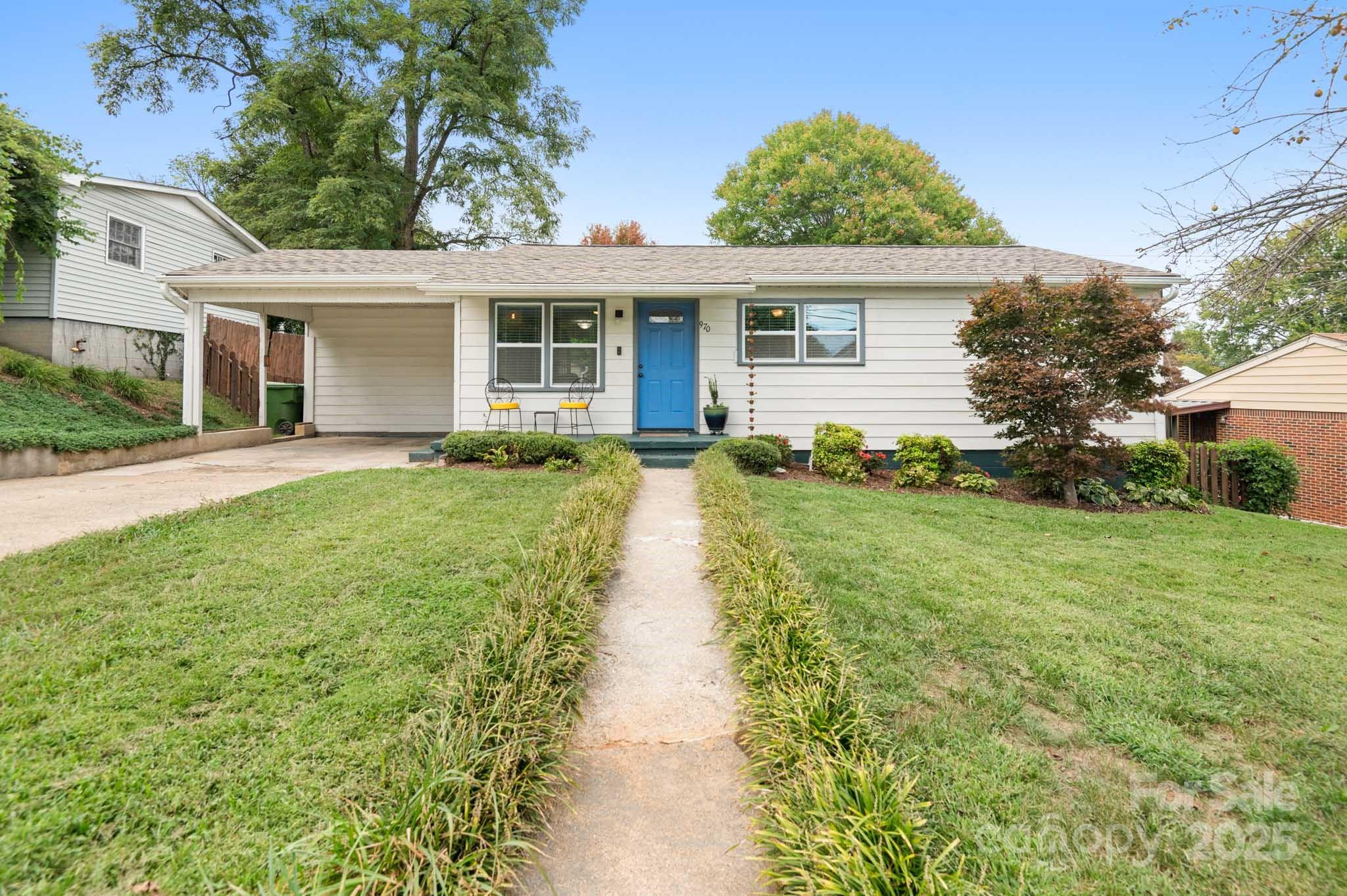 front view of a house with a yard