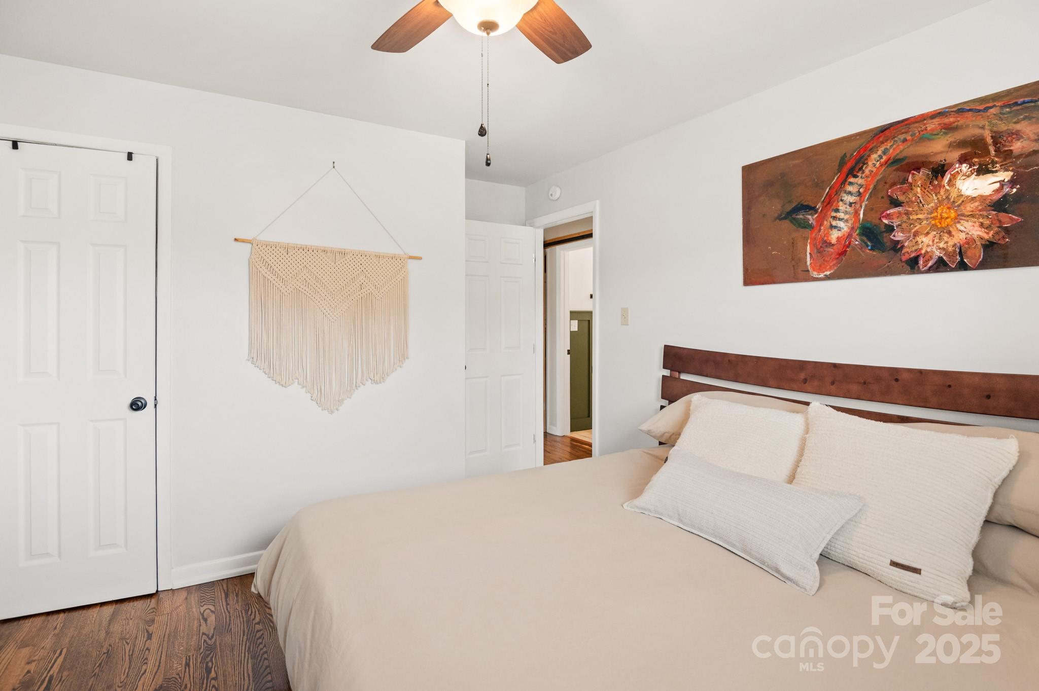 970 West Chapel Road Asheville, NC 28803 - Photo 11 of 19 a bedroom with a bed and a painting on the wall