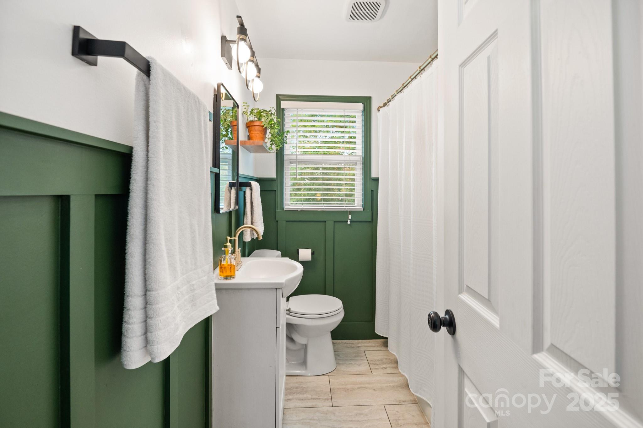 970 West Chapel Road Asheville, NC 28803 - Photo 4 of 19 a bathroom with a sink toilet and shower