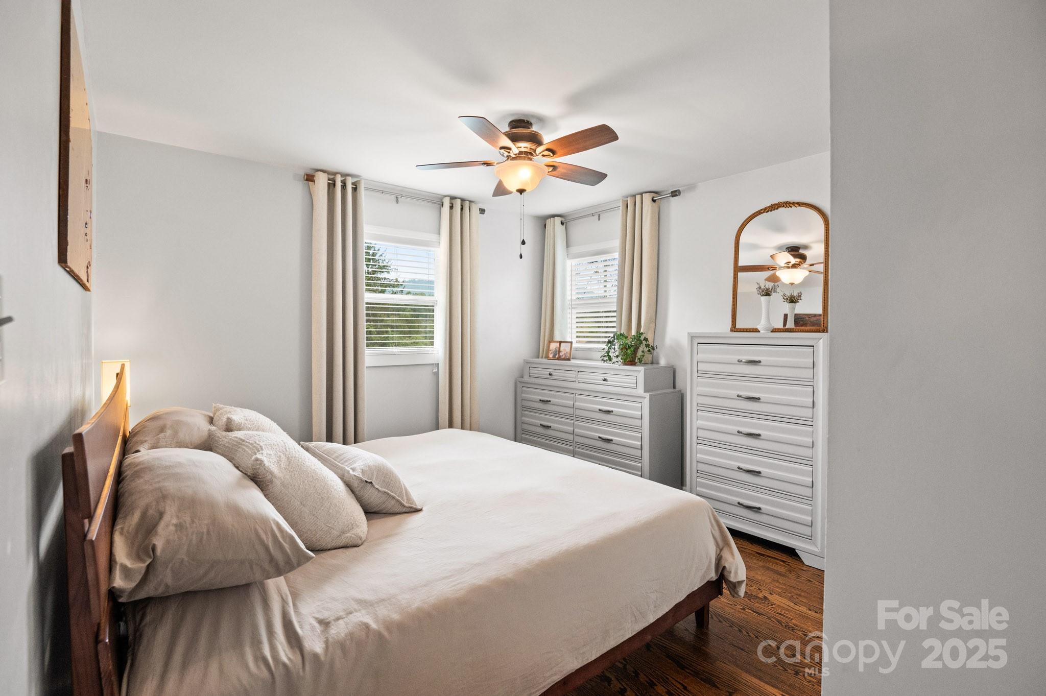 970 West Chapel Road Asheville, NC 28803 - Photo 6 of 19 a bedroom with a bed and a chandelier