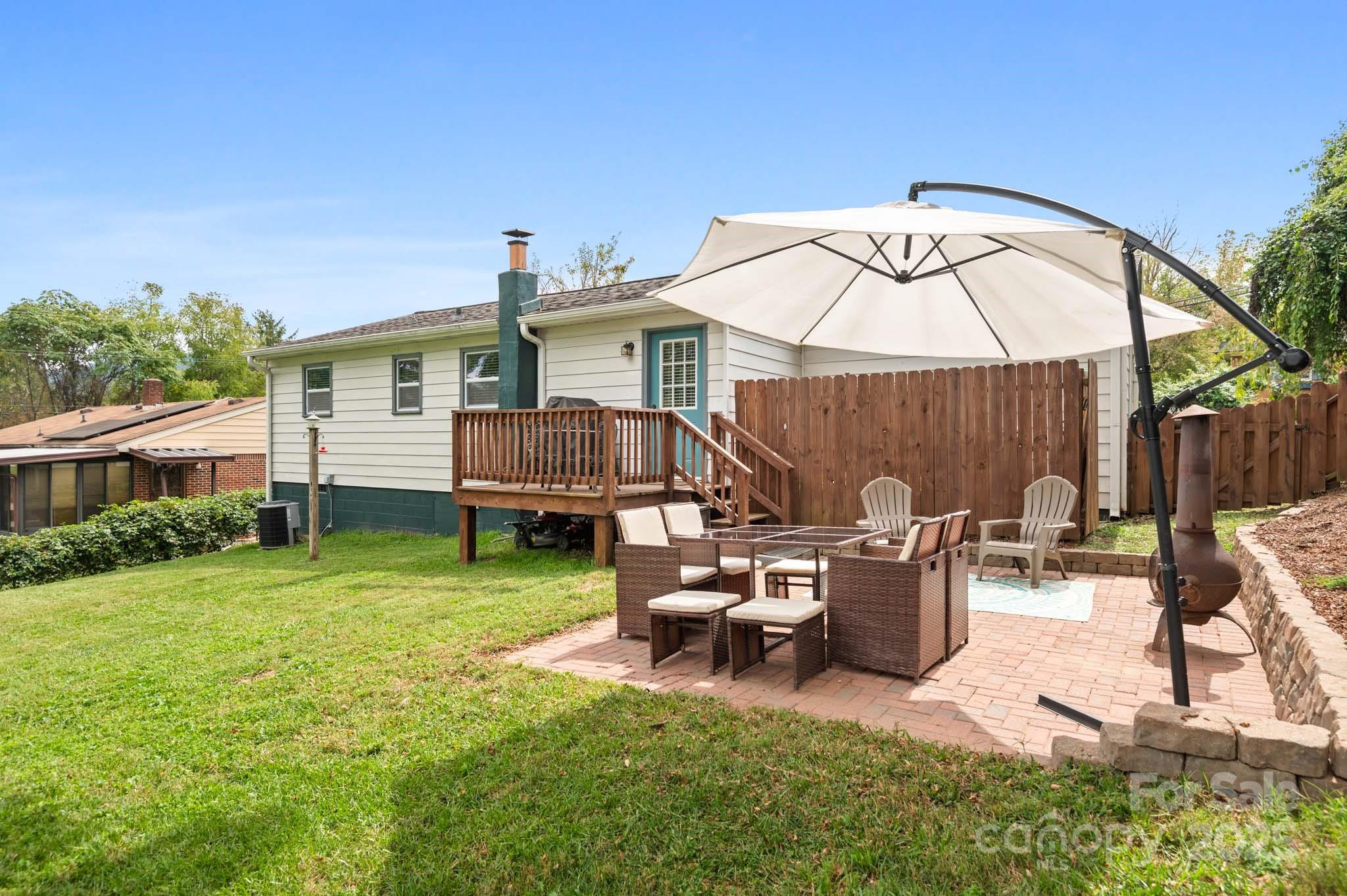 970 West Chapel Road Asheville, NC 28803 - Photo 8 of 19 a view of a house with backyard and sitting area