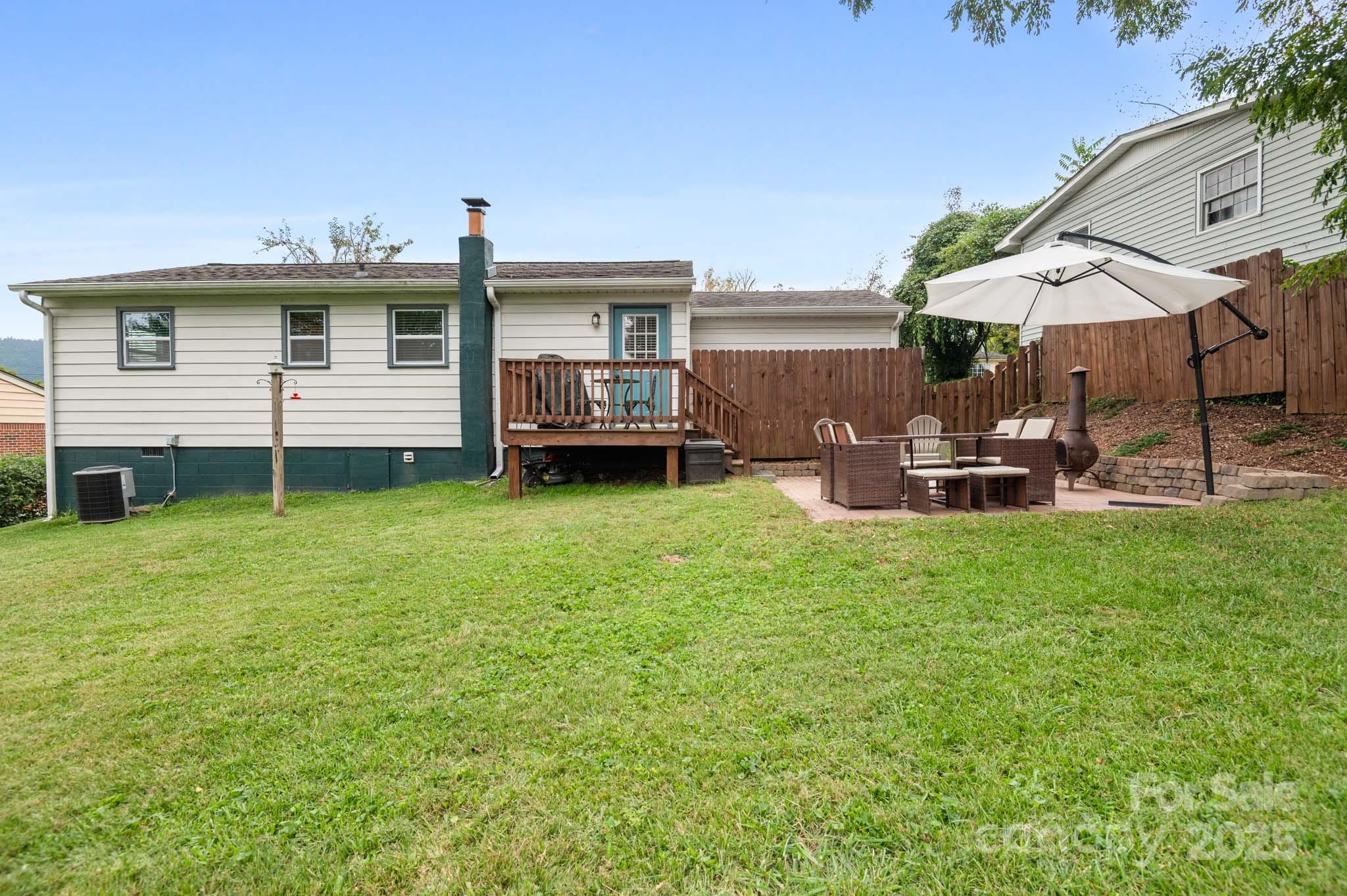970 West Chapel Road Asheville, NC 28803 - Photo 9 of 19 a view of a house with backyard and porch